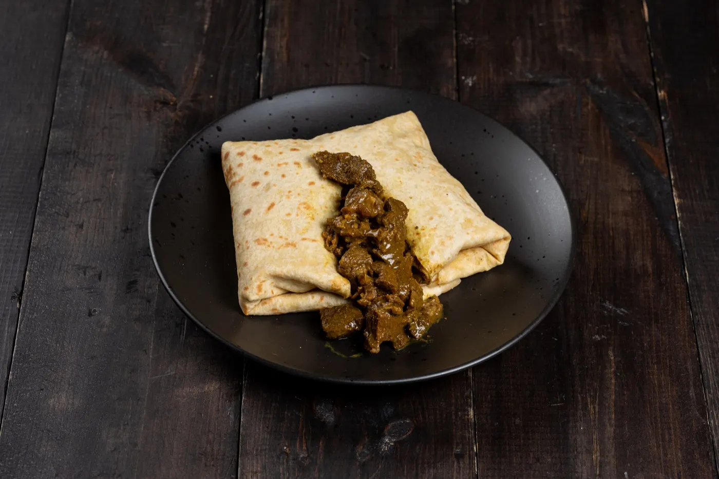 Curry goat roti