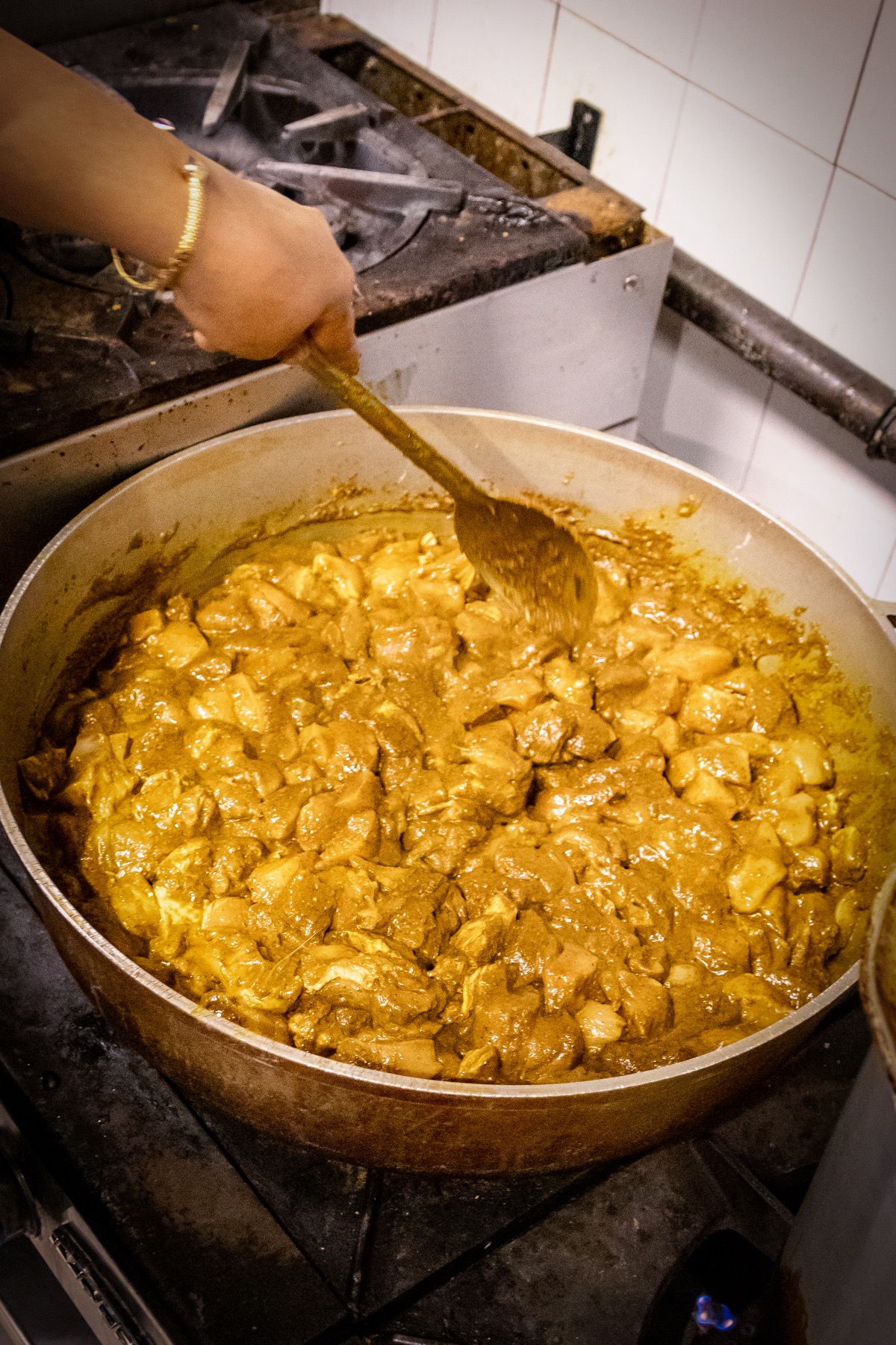 Curry cooking in The Roti Hut kitchen
